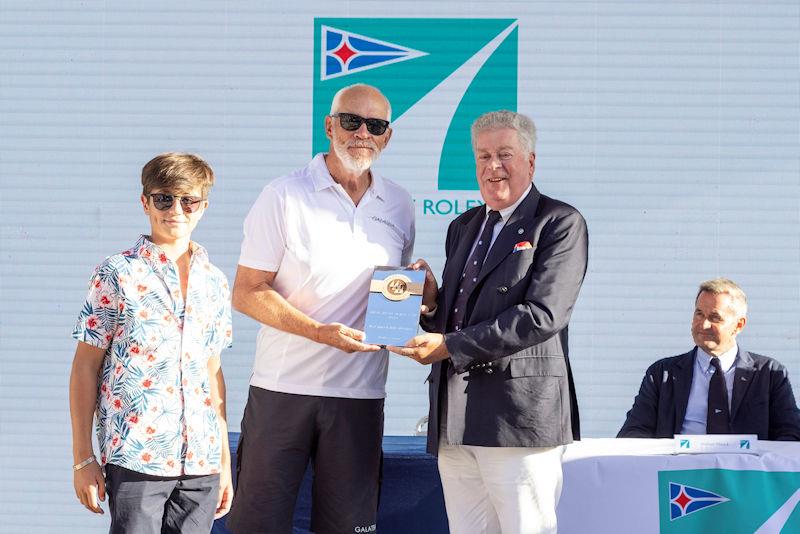 David M. Leuschen collects the trophy for the best placed IMA member from Secretary General Andrew McIrvine at the Maxi Yacht Rolex Cup 2022 photo copyright IMA / Studio Borlenghi taken at Yacht Club Costa Smeralda and featuring the Maxi class