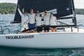 TROUBLEMAKERS, TITLEMAKERS: Eddie Gary and his Troublemaker team celebrate aboard their boat moments after securing the 2026 Corinthian Melges 24 U.S. National Championship on Grand Traverse Bay &copy; Anna Suslova