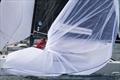 CHOREOGRAPHY IN COLOR: Dick Kalow's Mustang executes the spinnaker douse, as bowman Emory Williams gathers the kite. Its sweeping folds create a moment of artistry amid the intensity of championship racing &copy; Anna Suslova
