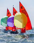 Gliding down to the bottom mark in order, Thomas & Kai Funke (Green spinnaker, 3rd overall); David Meehan & Henry Olsen (Purple Spinnaker, 2nd overall) and James & Harry Komweibel (Yellow Spinnaker, 1st overall) on the Marriott Mirror Worlds final day © Chris Clark