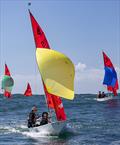 Surfing down the front of a swell, James & Harry Komweibel glide down to the bottom mark while being pursued by Thomas and Kai Funke (green spinnaker, 3rd overall) and Paul and Polly Changuion (blue spinnaker, 4th overall) at the Marriott Mirror Worlds © Chris Clark