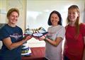 'Cakes galore at the Grand Opening of the York Railway Institute Sailing Club newly extended club house: Helen Butters and Frances Davies of Yorkshire Rows were presented with a cake in the shape of their boat, baked by Kate Skelton of Compass Cakes © Angela Craggs