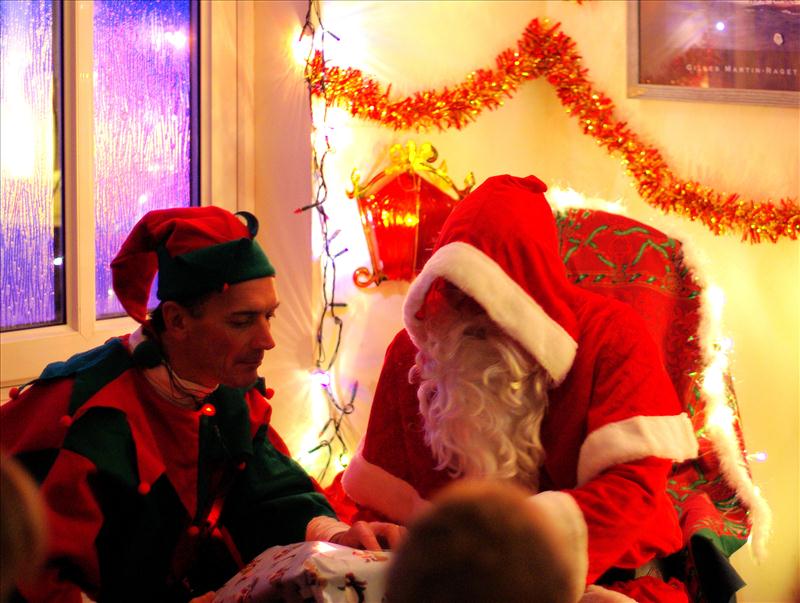 Santa Claus and a hard working elf visit the Manor Park Sailing Club Christmas party photo copyright Lee Bratley taken at Manor Park Sailing Club