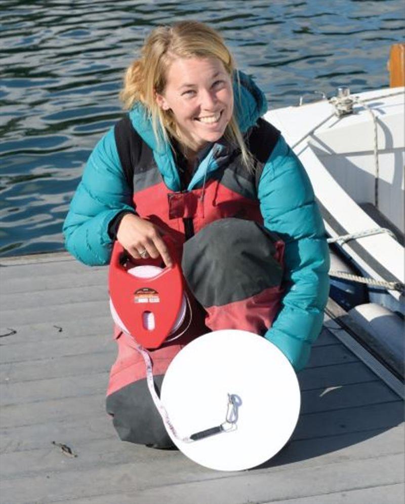 Seafarer citizen scientist and yachtswoman Susie Goodall with a 30 cm diameter Secchi Disk and Fibreglass tape measure photo copyright Secchi Disk taken at 