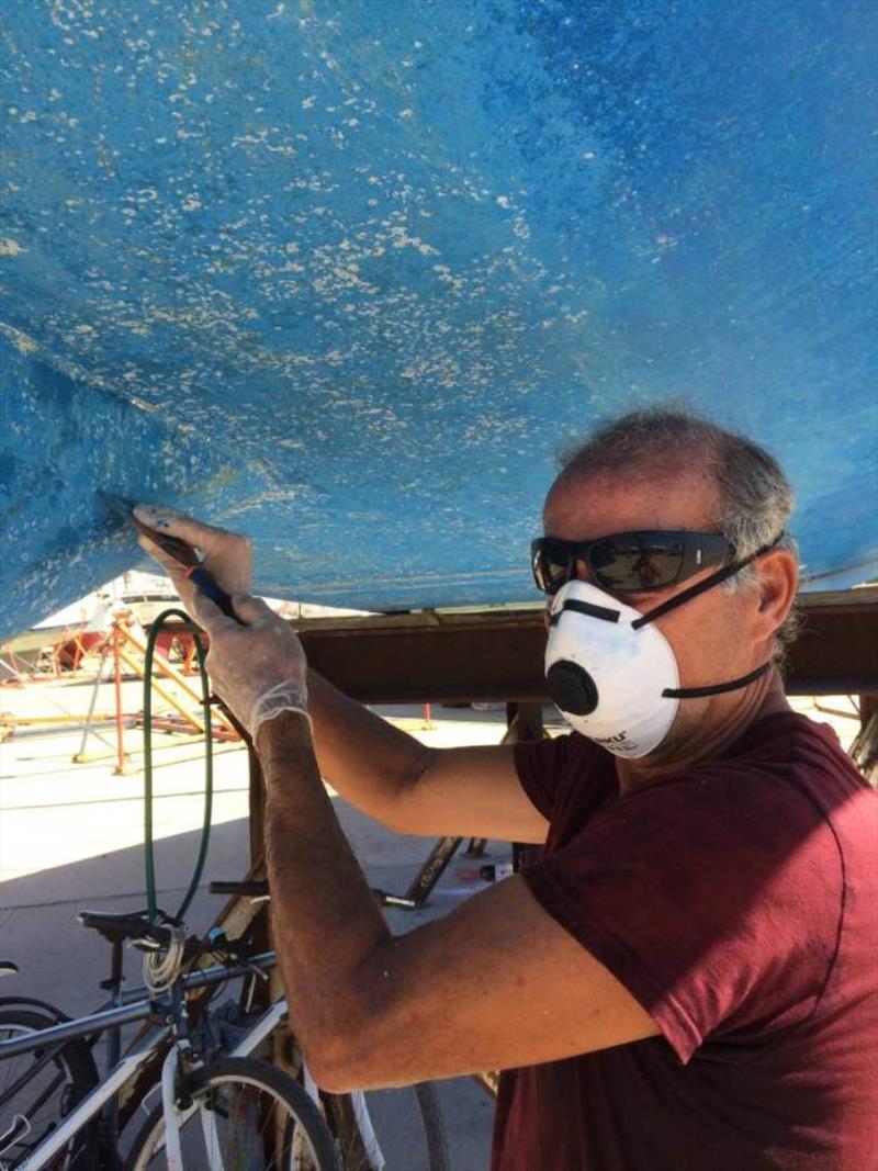 Removing barnacle rings residue - photo © SV Red Roo