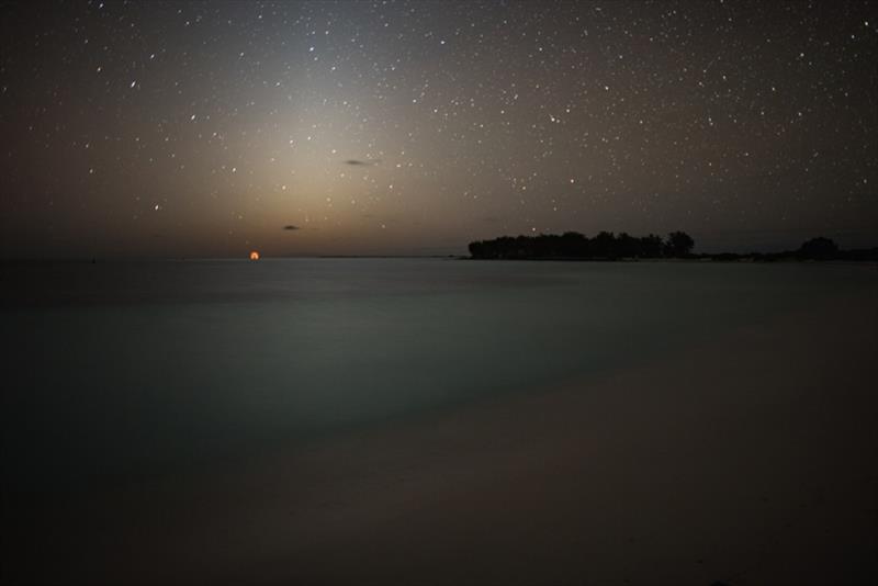 Moonrise over the horizon at Midway Atoll photo copyright NOAA Fisheries / Steven Gnam taken at 