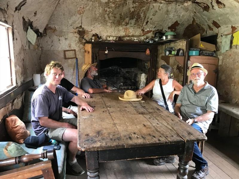 Inside the shack, Jimmy and Garry Kerr in the foreground. Just like it was left 100 years ago. (You don't see this sort of thing in The Whitsundays). - photo © Tim Phillips