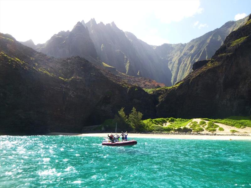 Today was a special day on the water — we surveyed reefs around the Na Pali Coast. We find mostly rocks and boulders below water's surface. Fishes enjoy the shelter of boulders, while small coral colonies grow and claim their space on top of the boulders. - photo © NOAA Fisheries / Mia Lamarind