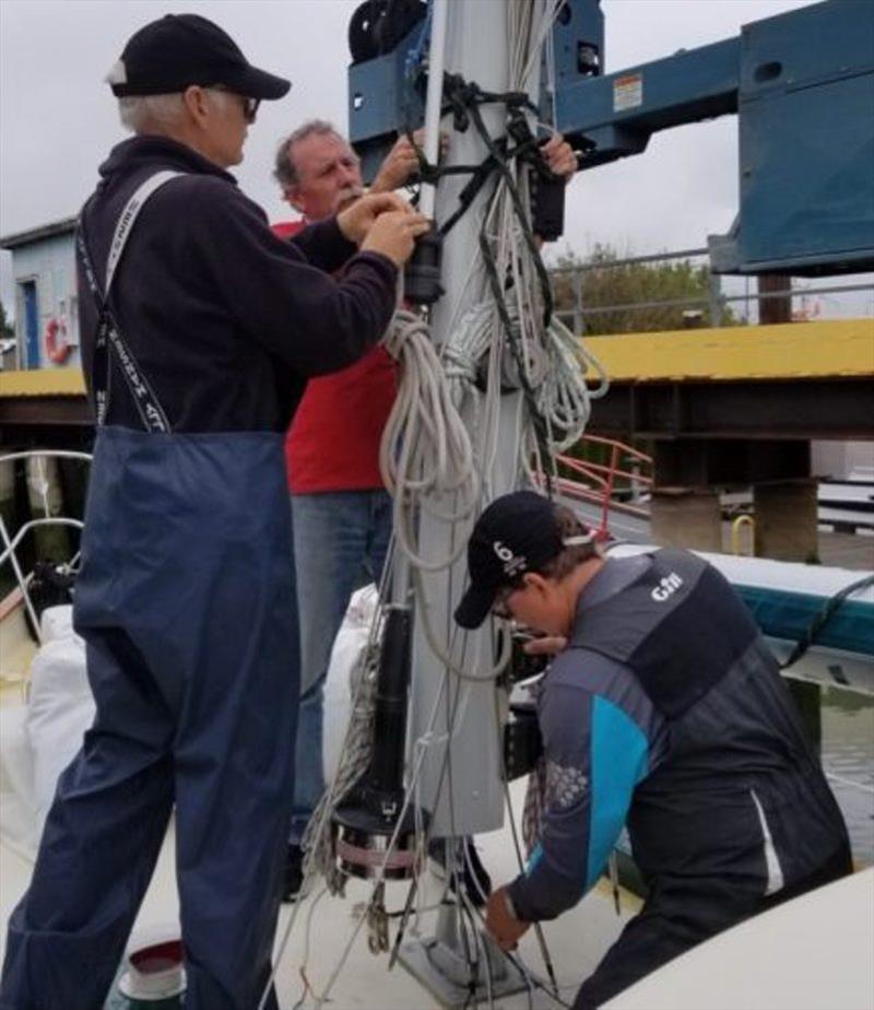 Putting the mast back on Galene. - photo © Bluewater Cruising Association