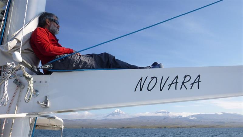 Steve Brown s/v Novara - Relaxing on the boom photo copyright Dr. Guido Marx taken at Ocean Cruising Club