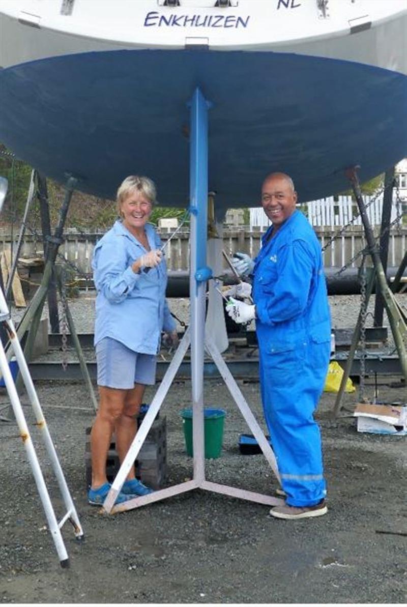 Martin and Ellen are working together to paint the underside of their Bavaria 45, Acapella photo copyright Lisa Benckhuysen taken at 