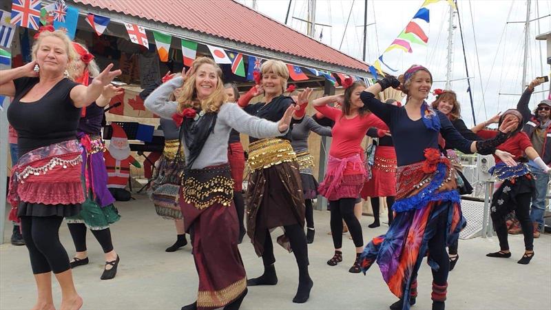 The belly dance troupe -  I wish we could say we were serving a higher purpose on this occasion, but maybe it's enough just to be having a bit of fun in our floating community.  - photo © Lisa Benckhuysen