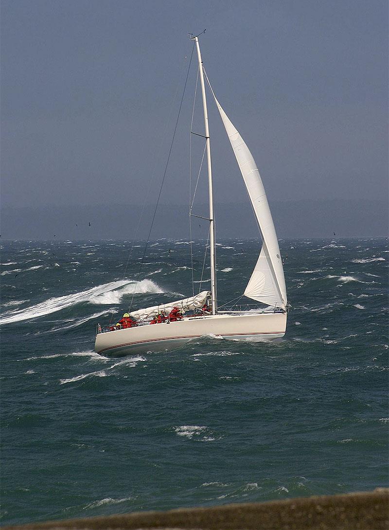 The Sydney 38 Mille Sabords (Blistering Barnacles) arrives at the finish line off Stanley - and yes it was blowing dogs off chains... - photo © John Curnow