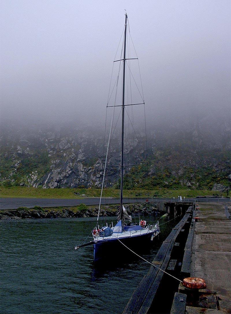 The Open 66 Gusto sits below Stanley's famous basalt massif, The Nut (and plenty of fog) photo copyright John Curnow taken at 