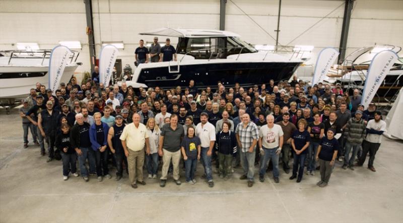 It takes a Factory! The team from Cadillac takes time out for a photo-op in front of the very first NC 895 to be produced in Cadillac, MI USA - photo © Jeanneau America