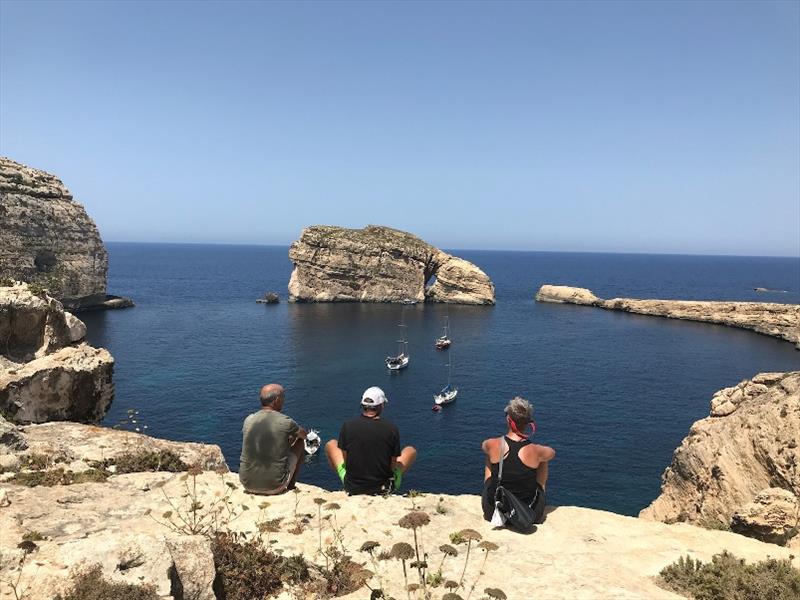 Phil, Jean and Yolene looking down at Red Roo and Caffe Latte anchored at Fungus Rock - photo © SV Red Roo