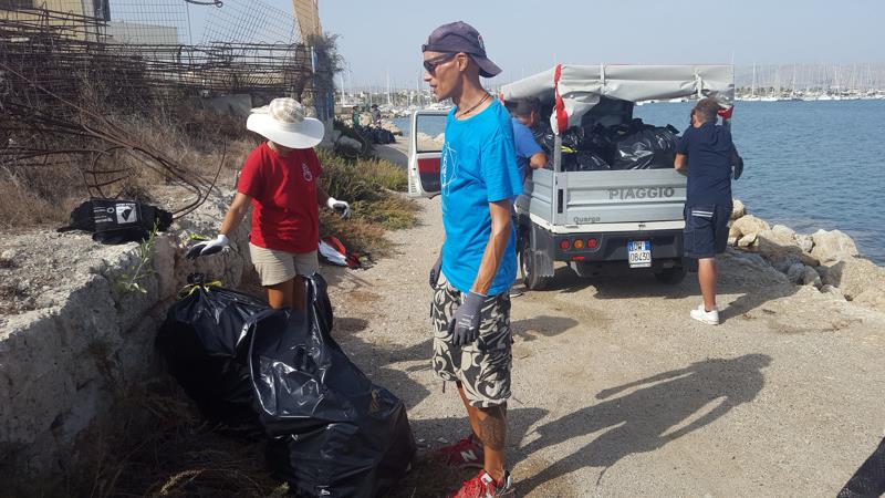 OCC members take coastal cleanup action photo copyright Phil Heaton taken at 