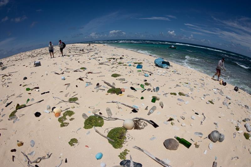 The marine debris team surveys plastics and other debris along the shoreline of Kamole (Laysan Island). - photo © NOAA Fisheries / Richard Chen