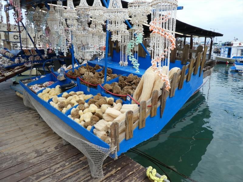 Selling sea sponges and shells at Rhodes Harbour - photo © SV Red Roo