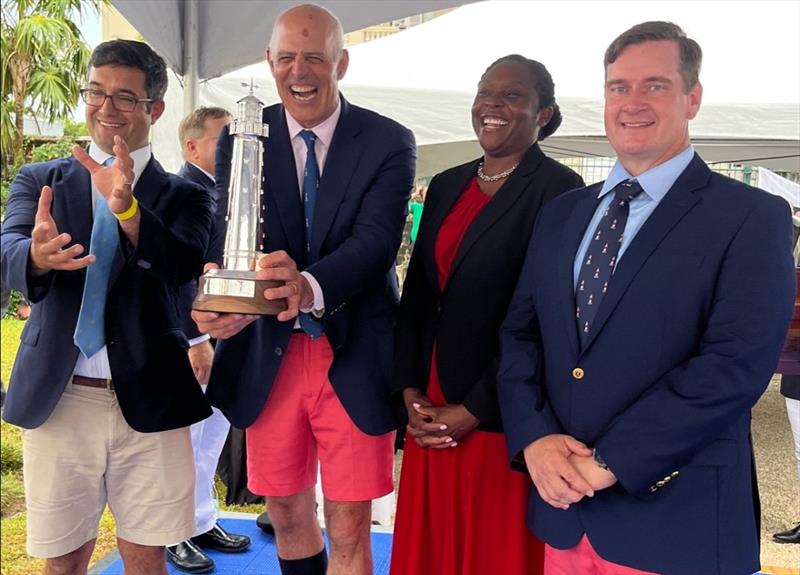 Receiving the Gibbs Hill Lighthouse Trophy, Charles Swans, Chris Sheehan, Chris Lewis photo copyright Trixie Wadson taken at Royal Bermuda Yacht Club