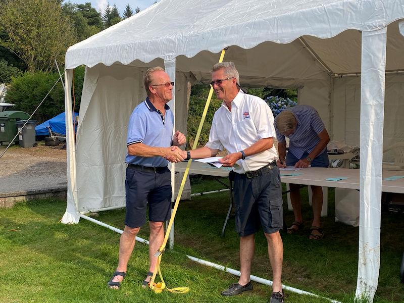 Scott Train (SYC Commodore) presents Gareth Jones (Kippford RNLI Operations Manager) with a substantial cheque with all the entry fees from the Regatta and donations from the recent SYC Challenger open meeting photo copyright Beatrice Overend taken at Solway Yacht Club