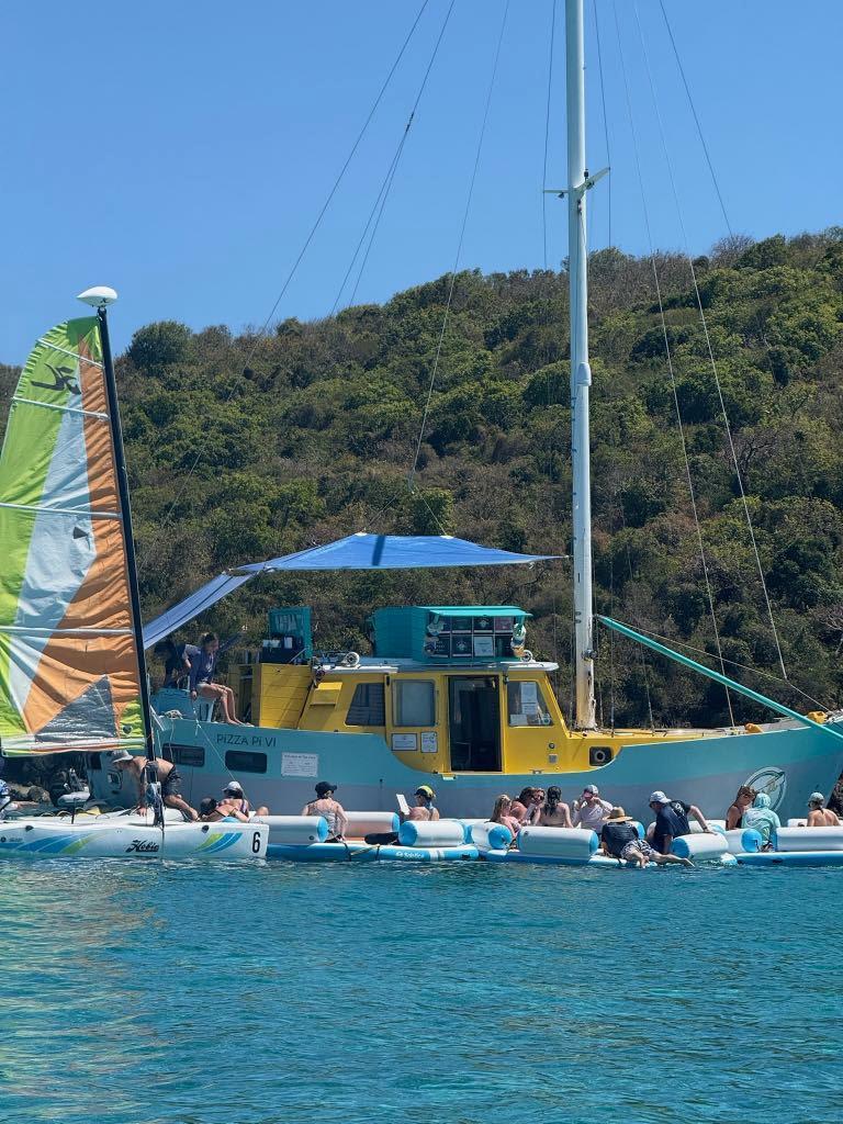 Lunch at Pizza Pi, the pizza boat in Christmas Cove - photo © Nikki Barnes