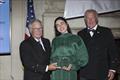 Young Voyager Award recipient Tamara Klink receives the honor from the incoming CCA Commodore Chace Anderson, left, and outgoing CCA Commodore Jay Gowell &copy; Guy Gurney