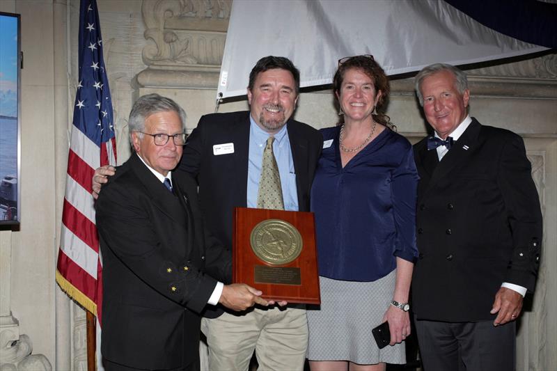 Christopher and Molly Barnes, center, receive the 2025 Far Horizons Award. With them are incoming CCA Commodore Chace Anderson, left, and outgoing CCA Commodore Jay Gowell - photo © Guy Gurney