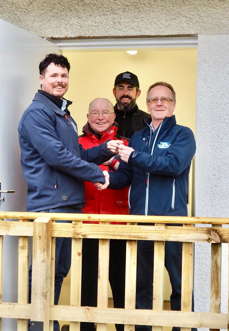 Handover day of the new facility, Paul Widdowson (left), and Martin Stitt (rear) Directors of South West Trades hand the keys to Scott Train, Commodore of the Solway Yacht Club with Robert Dinwiddie, past Commodore (centre) - photo © Kerry Widdowson