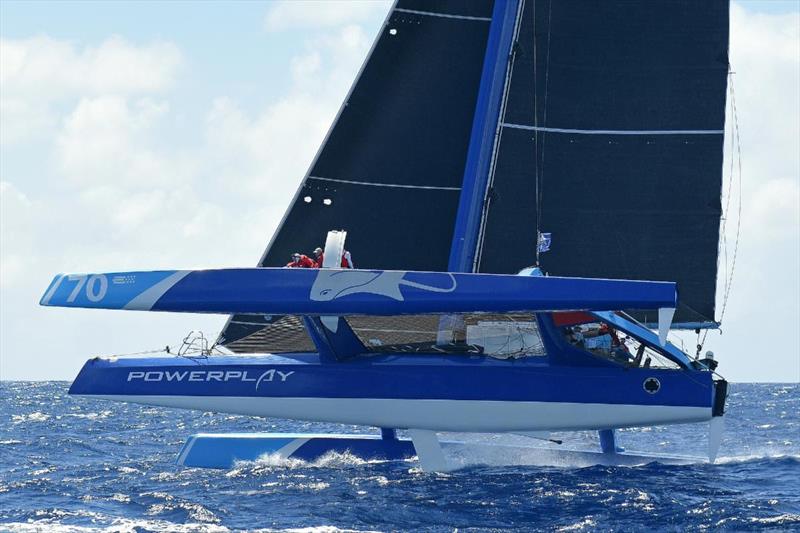 Peter Cunningham's MOD70 PowerPlay (CAY) flipped a wheelie on final approach before blasting off into the lead of the 13th RORC Caribbean 600 in a ball of spray at over 25 knots photo copyright Rick Tomlinson / www.rick-tomlinson.com taken at Antigua Yacht Club and featuring the MOD70 class