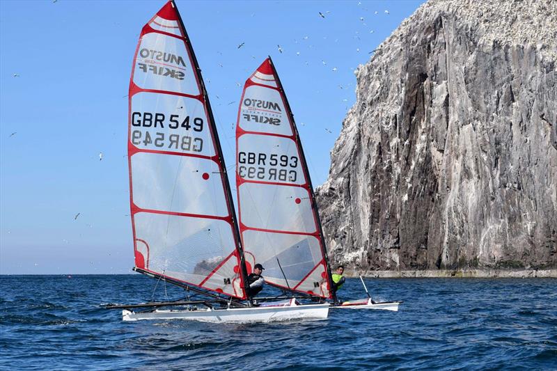 Musto Skiffs below The Bass Rock at North Berwick  - photo © Natalie Hilton