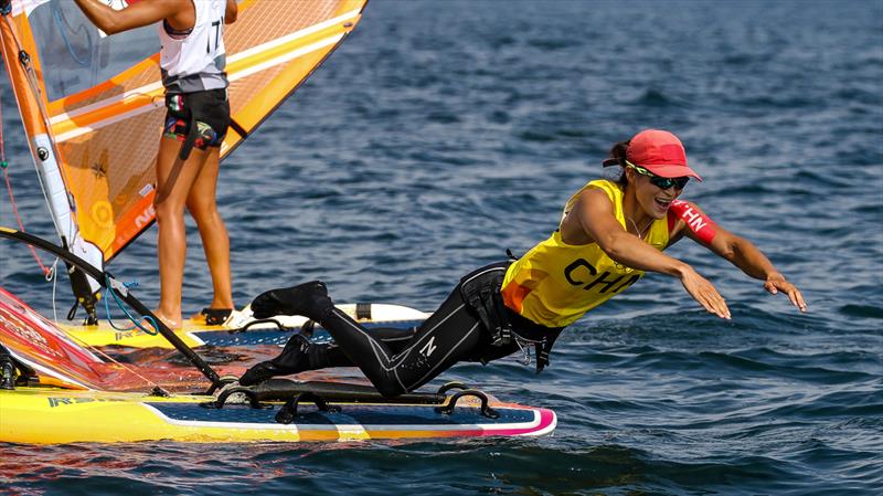 Yunxiu Lu (CHN) gold, dives to join her fellow medalists after the Womens RS:X Medal race - Tokyo2020 - Day 7- July, 31, - Enoshima, Japan. - photo © Richard Gladwell / Sail-World.com / nz