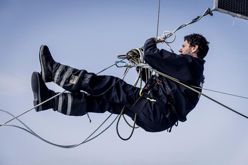 8 February 2023, Leg 2, Day 15 onboard Biotherm. Anthony Marchand cleaning the lazy sheet mess photo copyright Anne Beauge / Biotherm taken at  and featuring the IMOCA class