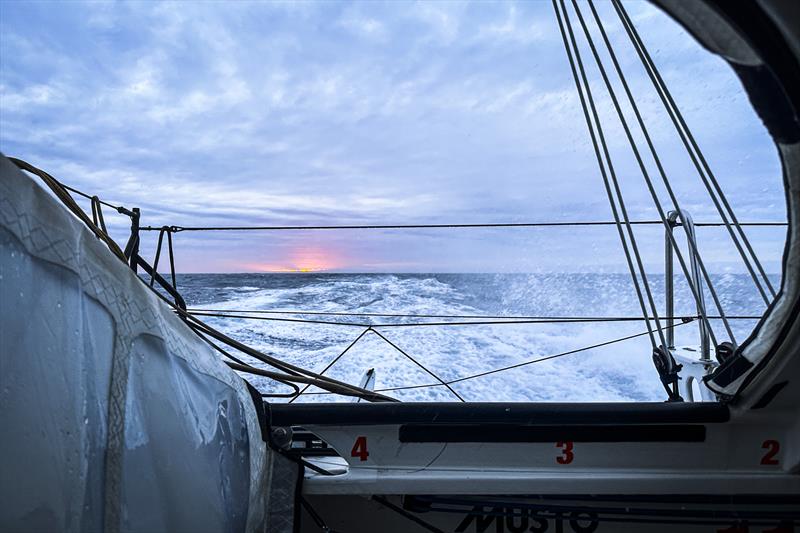 The Ocean Race 2022-23 Leg 3, day 18 onboard 11th Hour Racing Team. The sun pushes through the thick clouds to the west - the first sighting of the sun in a week - to end the day photo copyright Amory Ross / 11th Hour Racing / The Ocean Race taken at  and featuring the IMOCA class