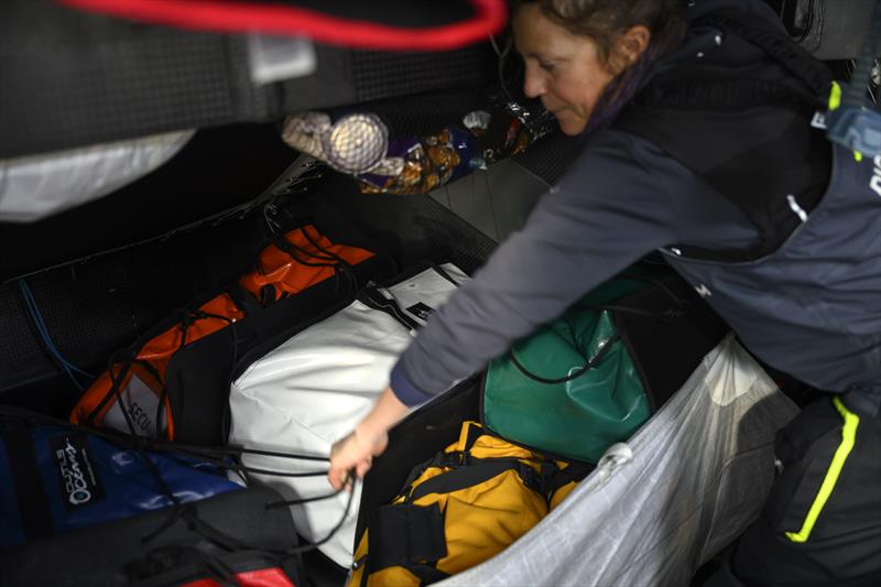 The Ocean Race 2022-23 Leg 3 onboard Biotherm. Sam Davies sorting out bags - photo © Ronan Gladu / Biotherm