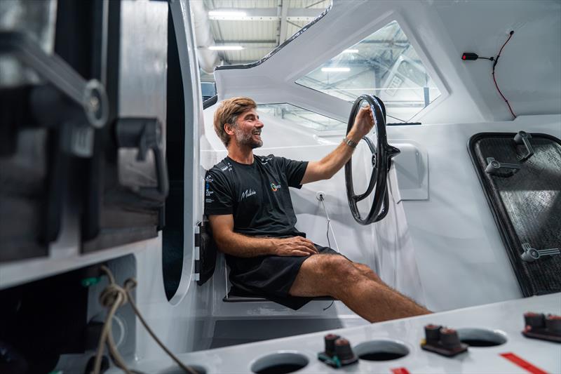 Boris Herrmann sitting in the cockpit of his new IMOCA race yacht which features steering wheels instead of a tiller - photo © Flore Hartout / Team Malizia
