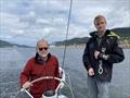 © David Schmidt Paul and Leo Bieker on Dark Star, with Ketchikan, Alaska, astern © David Schmidt