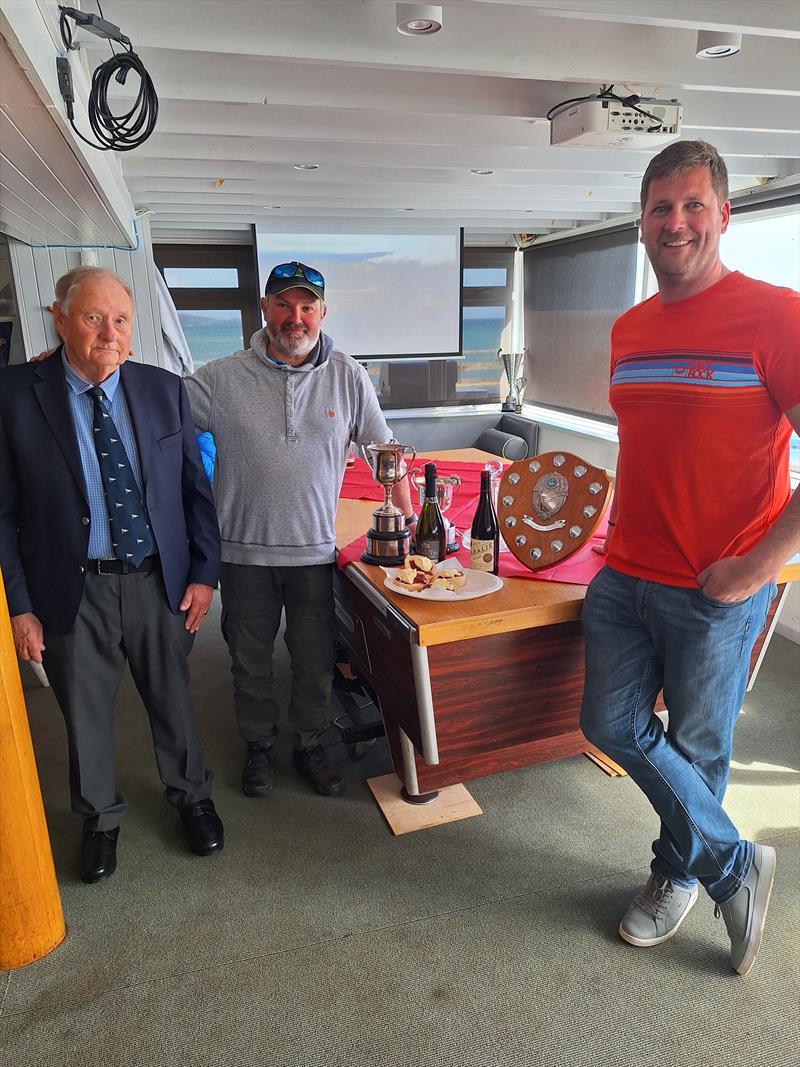 Tony Oliver presenting helm Terry Curtis and crew Peter Greig with their silverware during the Osprey Panmorra Cup at Mount's Bay Sailing Club photo copyright Kevin Francis taken at Mount's Bay Sailing Club, England and featuring the Osprey class