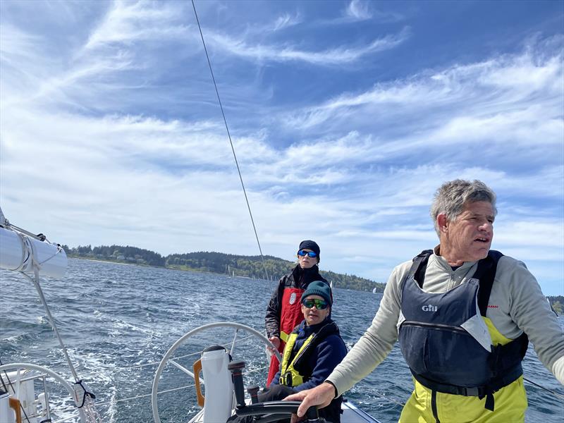 Libby McKee drives the uphill leg of the 2024 Blakely Rock Benefit Race, while Mark Reed trims main and Jonathan McKee keeps his eyes out of the boat - photo © David Schmidt