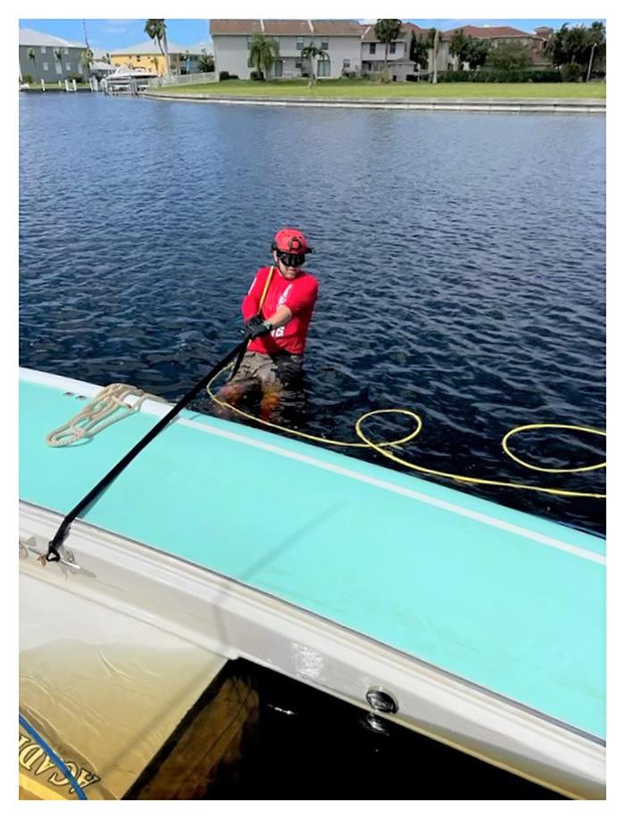 TowBoatUS salvage crews working in waters tainted by storm-driven pollution and dangerous debris, recover a vessel that was blown from its boat lift in Punta Gorda Isles photo copyright TowBoatUS Port Charlotte/ Pine Island taken at  and featuring the Power boat class