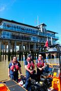 An RNLI boat crew from Tower Lifeboat Station, at Greenwich YC just before the RNLI fundraising race in 2024 © GYC
