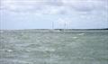 Gregory keeping his boat dead flat in a 25 knot gust. Chapeau © RS Class Associations