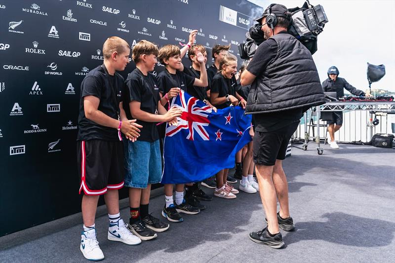 Matteo Barker and Blake Battten with first girls Zofia Wells and Charlotte Handley, on the SailGP main stage prizegiving - January 2025 photo copyright SailGP taken at Royal Akarana Yacht Club and featuring the RS Feva class