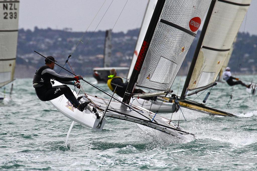 Nathan Outteridge (AUS) making a brave effort to complete the course with just one rudder. A-class catamaran World Championships, Day 3, Takapuna February 13, 2014 © Richard Gladwell www.photosport.co.nz