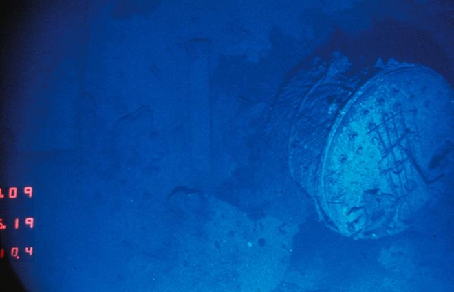 After searching for three weeks, and with just a few days of the expedition left, Argo glided over a boiler the size of a two-car garage and took a photo. They had discovered Titanic debris field, two and a half miles below the surface, nearly 400 miles south of Newfoundland.  © WHOI Archives