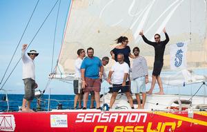 A jubilant crew on Sensation Class 40 celebrate their arrival photo copyright RORC/Arthur Daniel and Orlando K Romain taken at  and featuring the  class