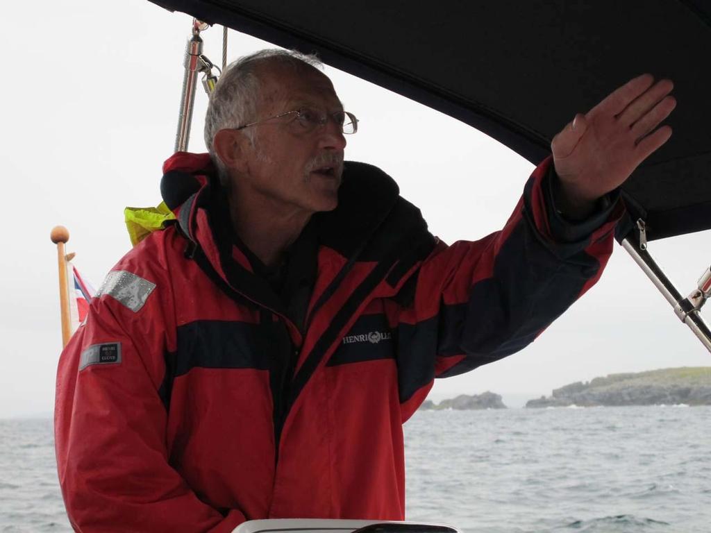 Lerwick sailor, Archie Green, at the helm of Distant Shores II © Paul and Sheryl Shard http://www.distantshores.ca/