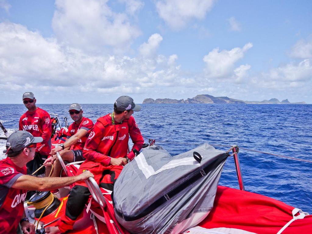 The crew look on at Fernando de Noronha Island onboard Camper with Emirates Team New Zealand during leg 1 of the Volvo Ocean Race 2011-12, from Alicante, Spain to Cape Town, South Africa. (Credit: Hamish Hooper/Camper ETNZ/Volvo Ocean Race) © Volvo Ocean Race http://www.volvooceanrace.com