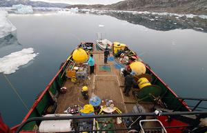 The aft deck of the M/V Viking Madsalex was the staging area to deploy the SF1 mooring in 2011 and for dragging operations to recover it in 2013. Clockwise from left WHOI scientist Magdalena Andres, MIT-WHOI graduate student Rebecca Jackson, WHOI oceanographer Fiamma Straneo, and WHOI mooring technician Will istrom. photo copyright Nick Beaird, WHOI taken at  and featuring the  class
