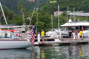 2014 Caribbean 1500 - Andy helping Lone Star with their dock lines photo copyright World Cruising Club http://www.worldcruising.com taken at  and featuring the  class